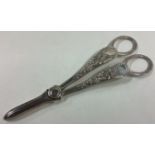 A heavy pair of Victorian silver grape scissors.