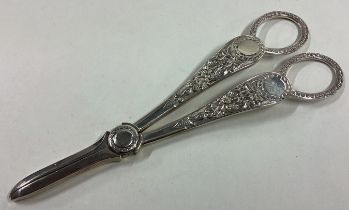 A heavy pair of Victorian silver grape scissors.