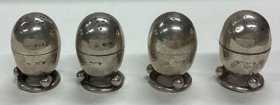 A set of four Victorian silver peppers. London 1891.