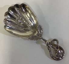 A rare naturalistic Victorian silver caddy spoon.