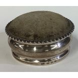 A large Victorian silver pin cushion.