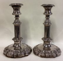 A pair of Old Sheffield silver plated telescopic candlesticks.