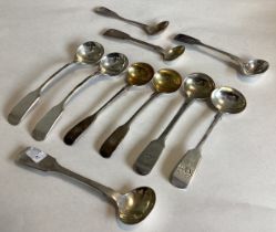 A large collection of Victorian and other silver fiddle pattern salt spoons.