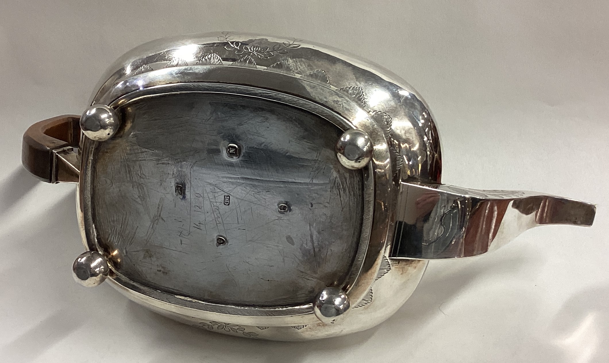 A George III silver teapot engraved with eagles and leaf decoration. - Image 5 of 5