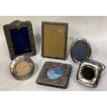 A collection of six silver mounted picture frames.