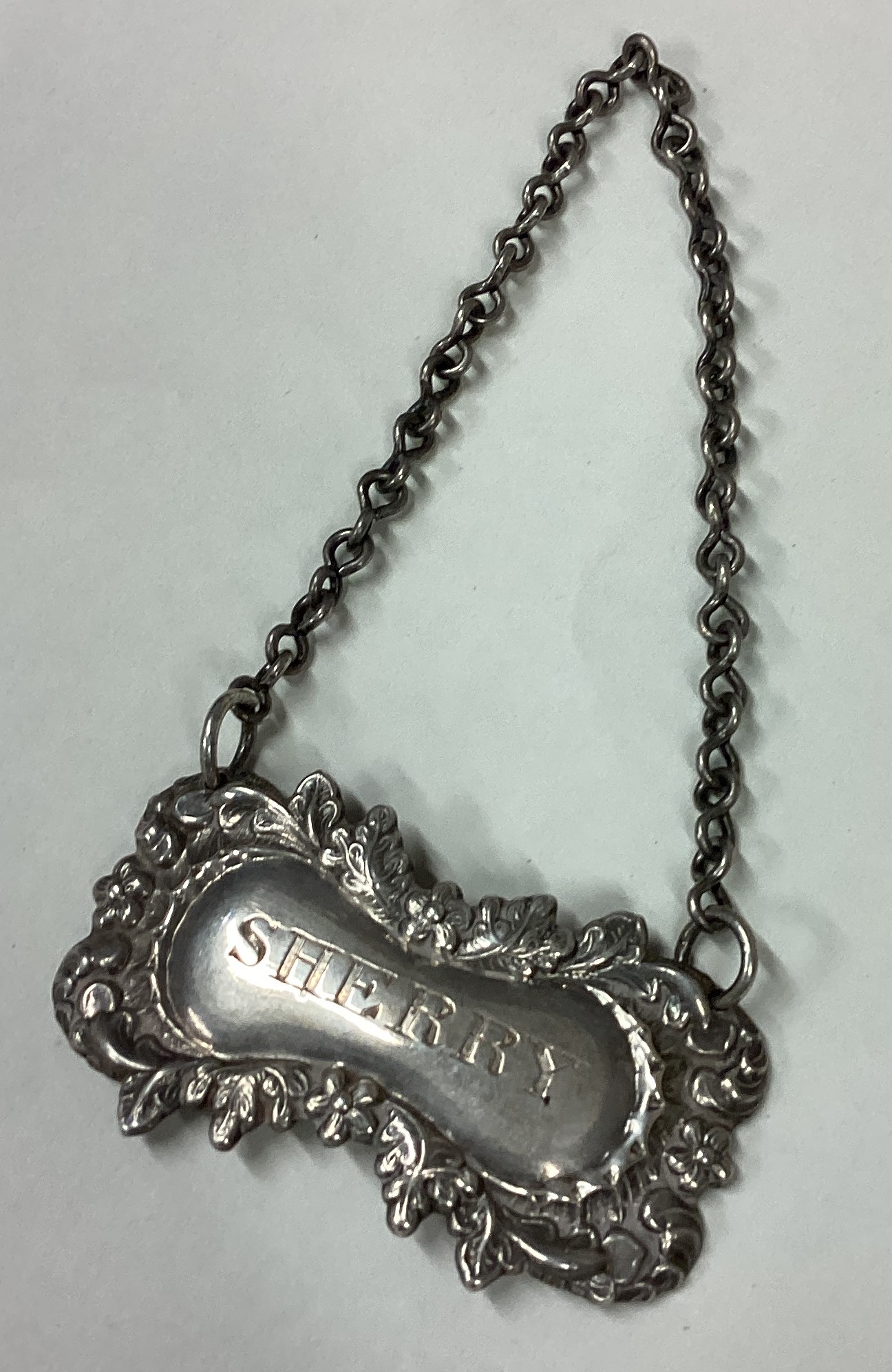 A Victorian silver wine label for 'Sherry'.