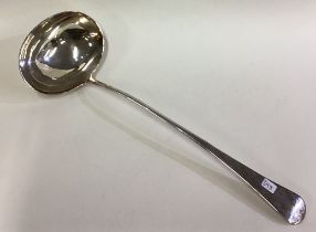 A George III silver soup ladle. London 1803.
