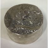 A heavy Modernistic silver box with unusual decorated lid.