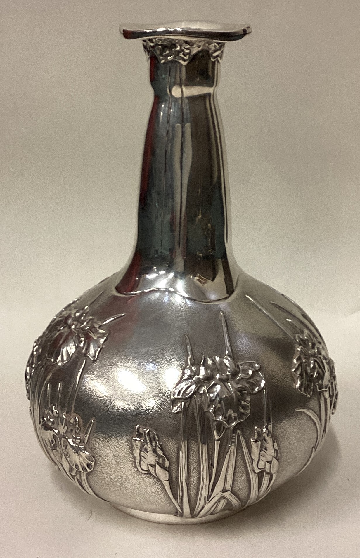 An American silver vase in the Japanese style embossed with chrysanthemum decoration.