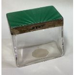 A silver, green enamelled and glass box.