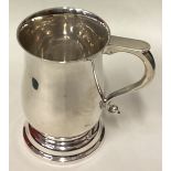 A large silver pint mug in the Georgian style.