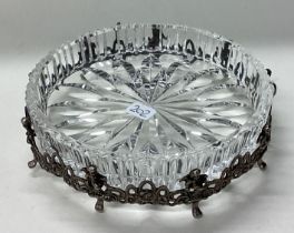 A pierced Continental silver and glass bowl cast with cherubs.