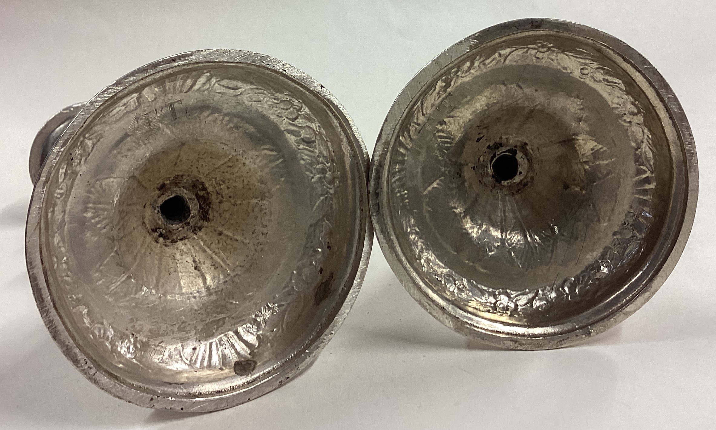 A pair of early Queen Anne cast silver candlesticks. - Image 3 of 4