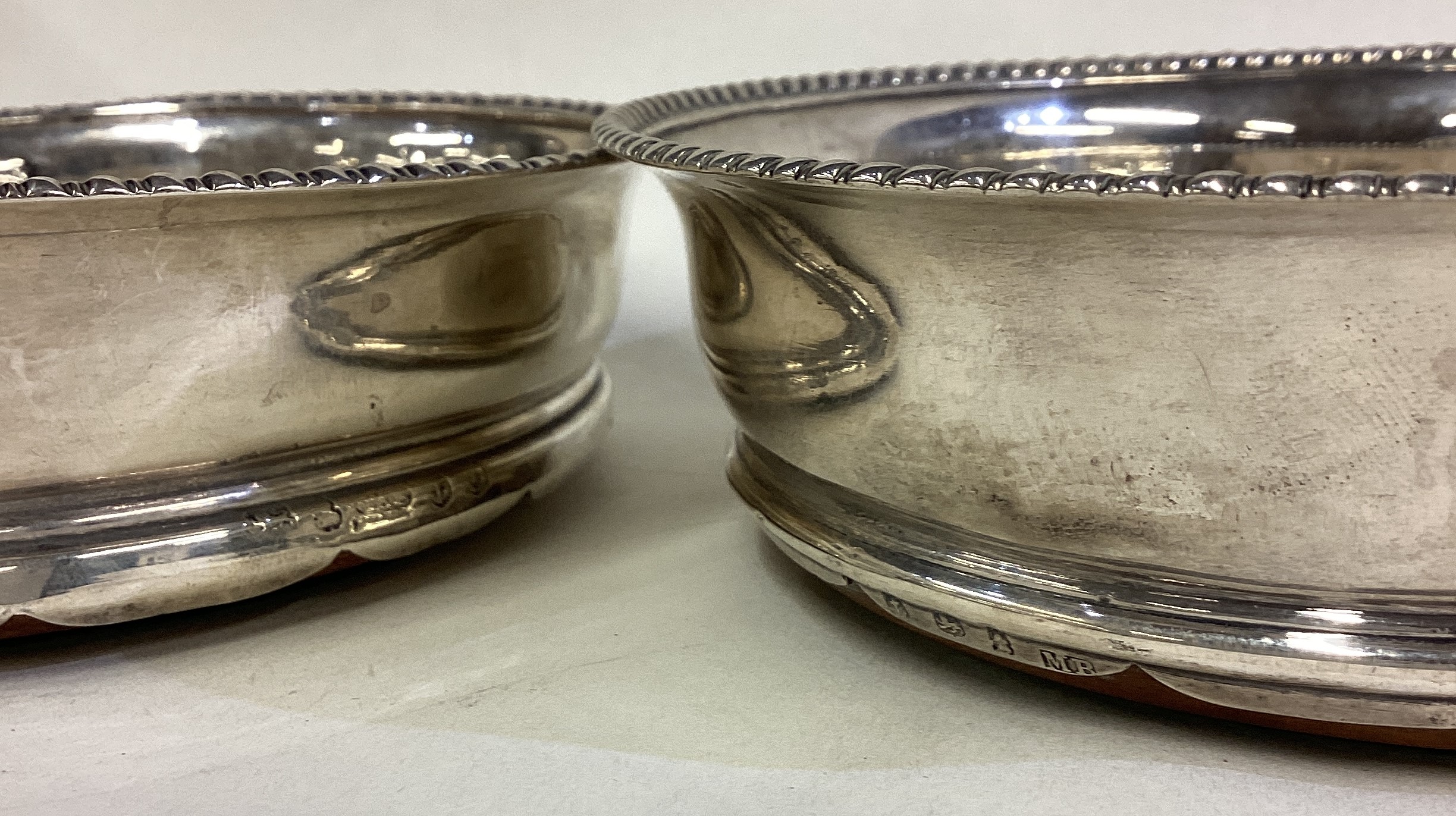 A matched pair of George III silver coasters. - Image 3 of 3
