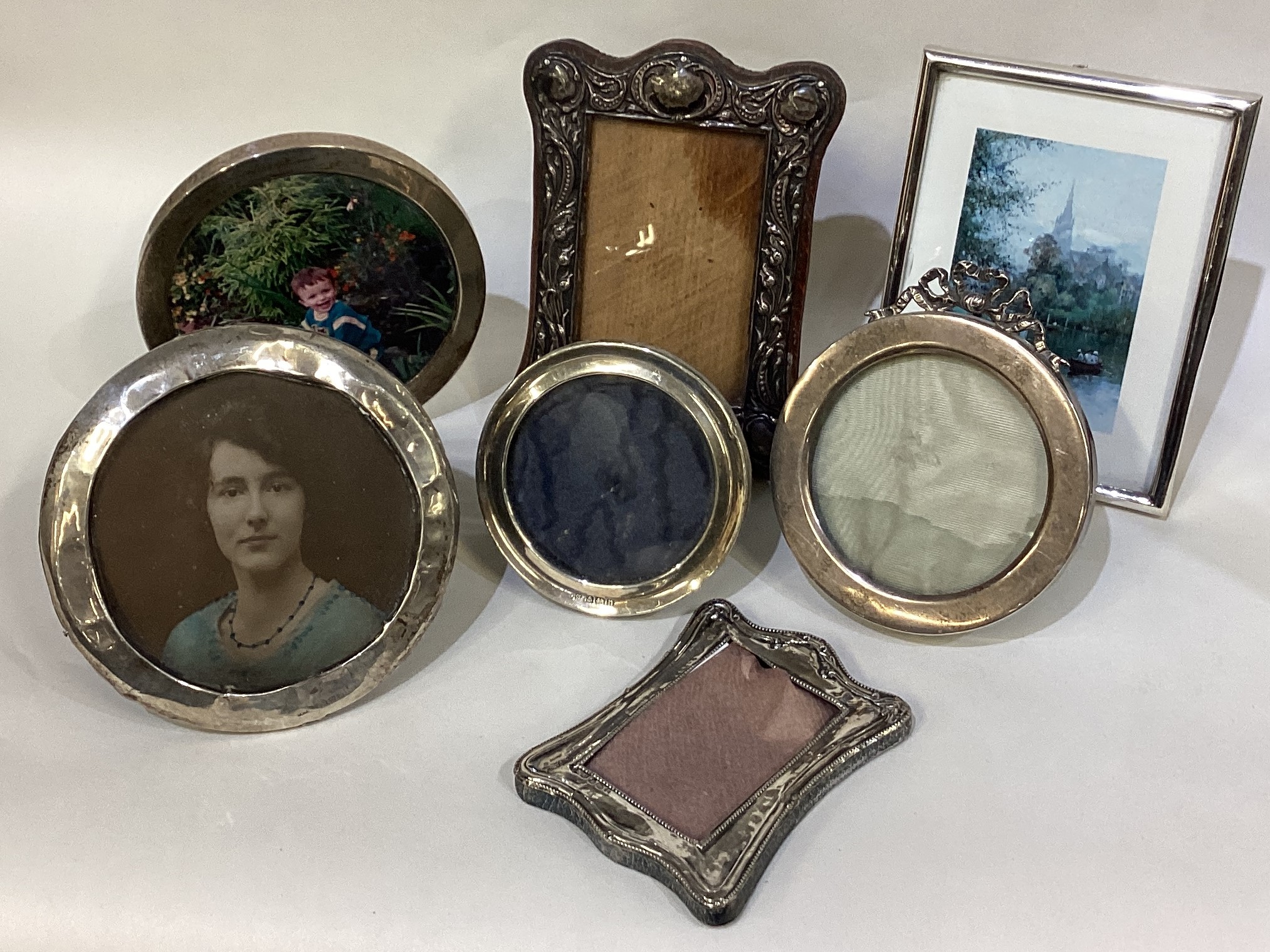 A good collection of silver mounted picture frames.