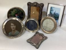 A good collection of silver mounted picture frames.