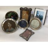 A good collection of silver mounted picture frames.