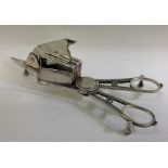 A pair of George III silver candle snuffers.