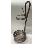 A large Continental silver wine bottle holder with pierced decoration.