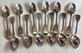 A large collection of silver fiddle pattern teaspoons.