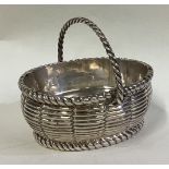 A Victorian silver basket with weave decoration.