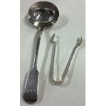 A silver fiddle pattern sauce ladle together with a pair of tongs.