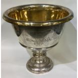 TIFFANY & CO: A large silver trophy cup with gilt interior.