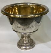 TIFFANY & CO: A large silver trophy cup with gilt interior.
