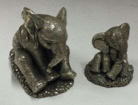Two silver mounted figures of elephants.