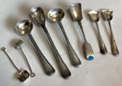 A collection of silver mounted salt spoons.