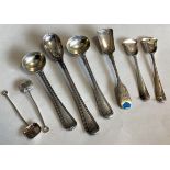 A collection of silver mounted salt spoons.