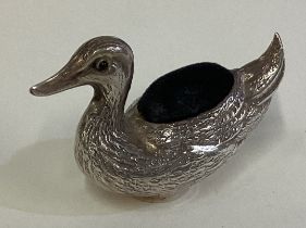 A novelty silver pin cushion in the form of a duck.