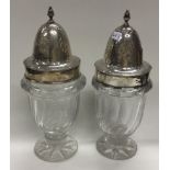 DUBLIN: A pair of large 18th Century Georgian Irish silver and glass casters.