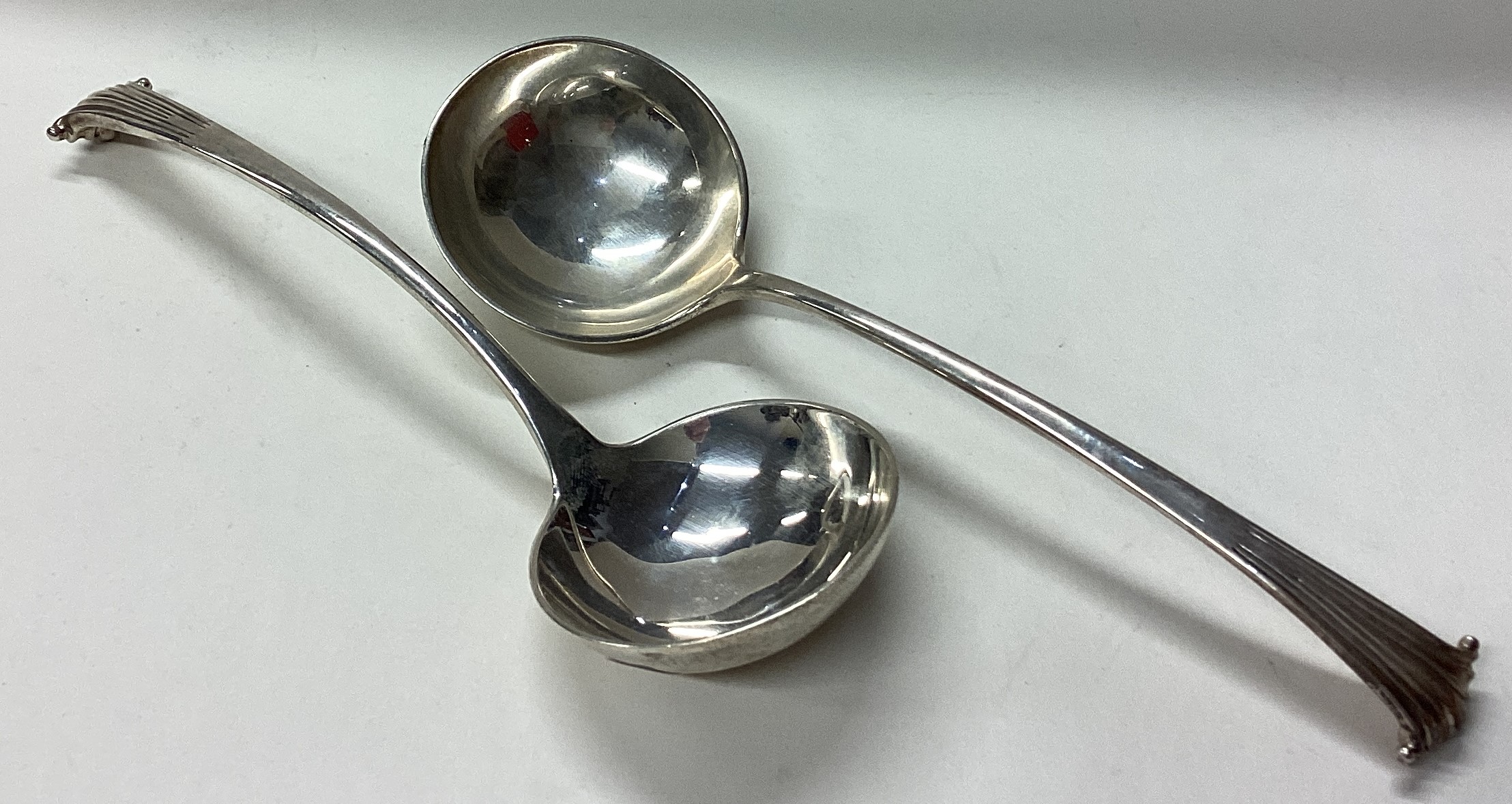 A pair of heavy silver Onslow pattern ladles.