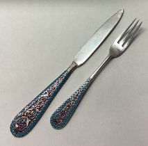 A Russian silver and enamelled knife and fork set.