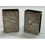 A pair of American silver match holders with chased decoration.