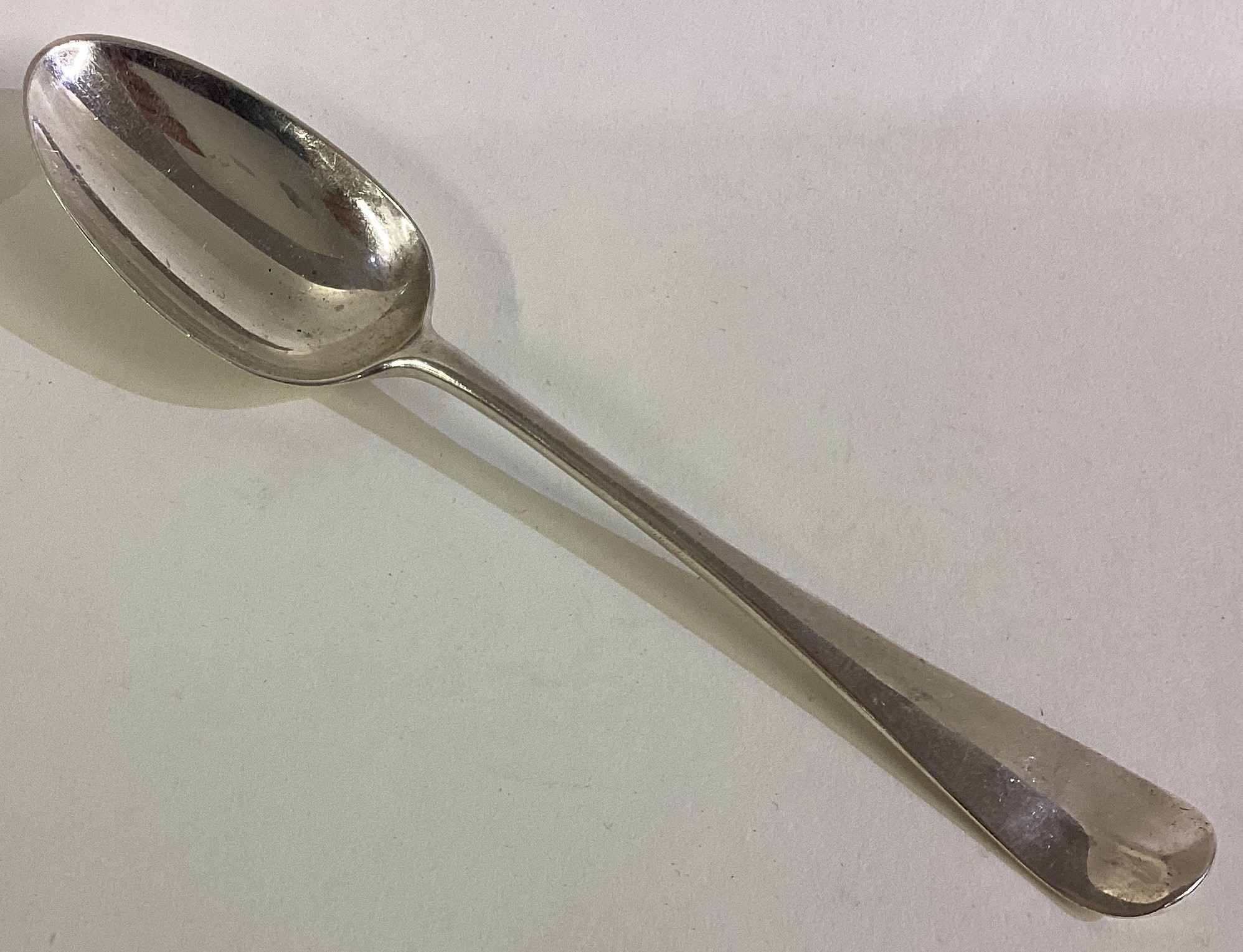 An 18th Century silver bottom marked tablespoon.