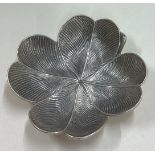 BUCCELLATI: A silver counter dish in the form of a flower.