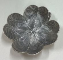 BUCCELLATI: A silver counter dish in the form of a flower.
