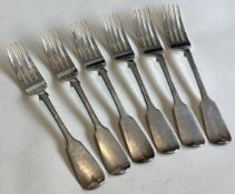EXETER: A heavy set of six silver fiddle pattern table forks.