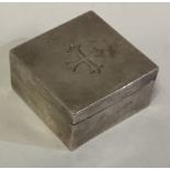 A square Edwardian silver pill box with cross decoration.