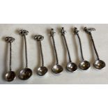 A collection of Continental silver salt spoons with chased decoration.