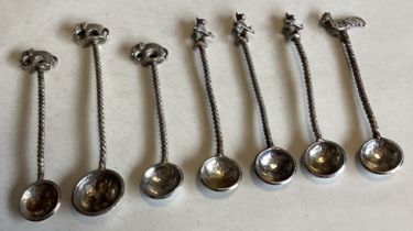 A collection of Continental silver salt spoons with chased decoration.