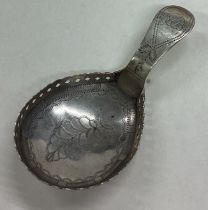 A George III silver caddy spoon. Birmingham 1807.