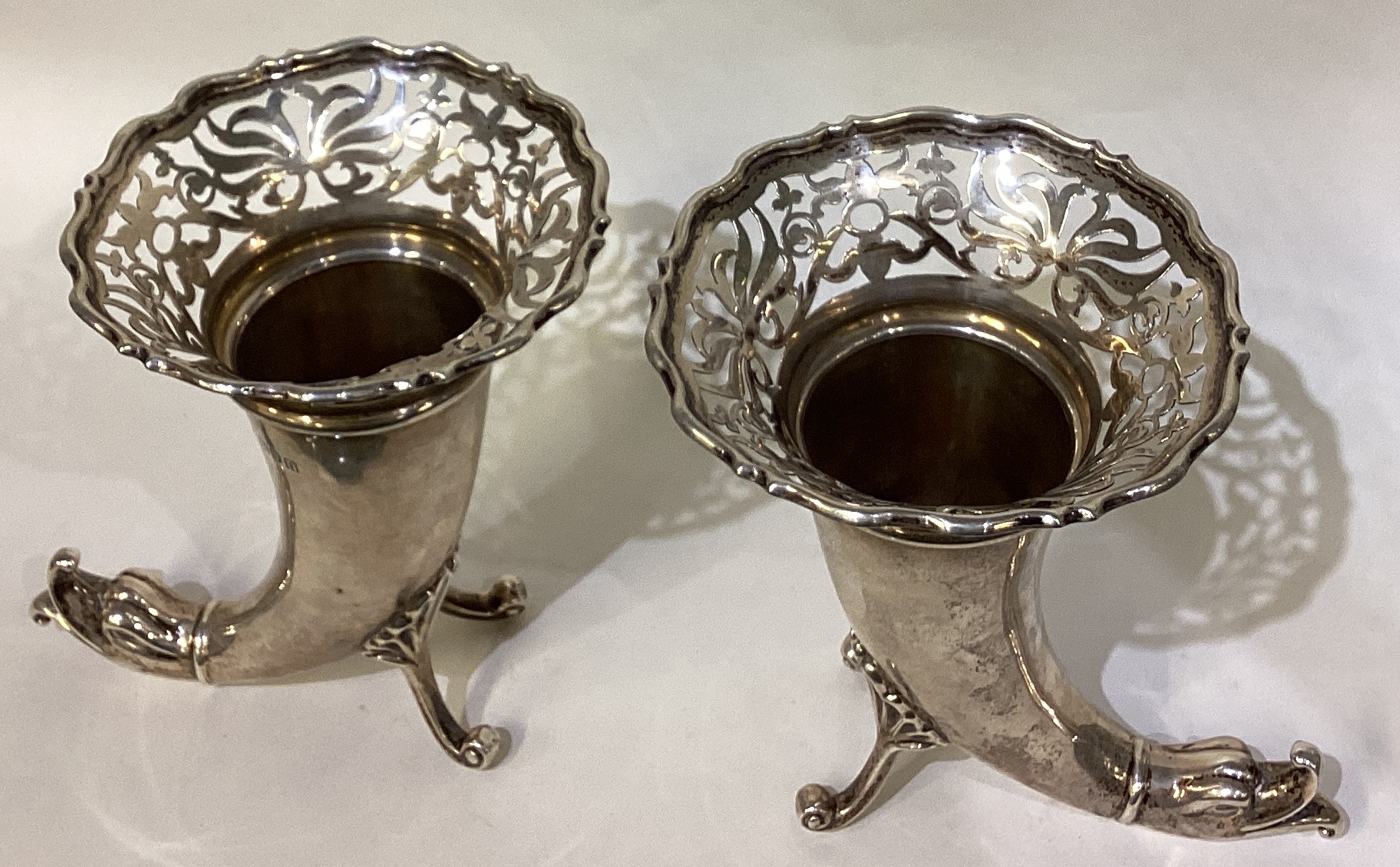 A pair of pierced silver vases in the form of dolphins. - Image 2 of 3