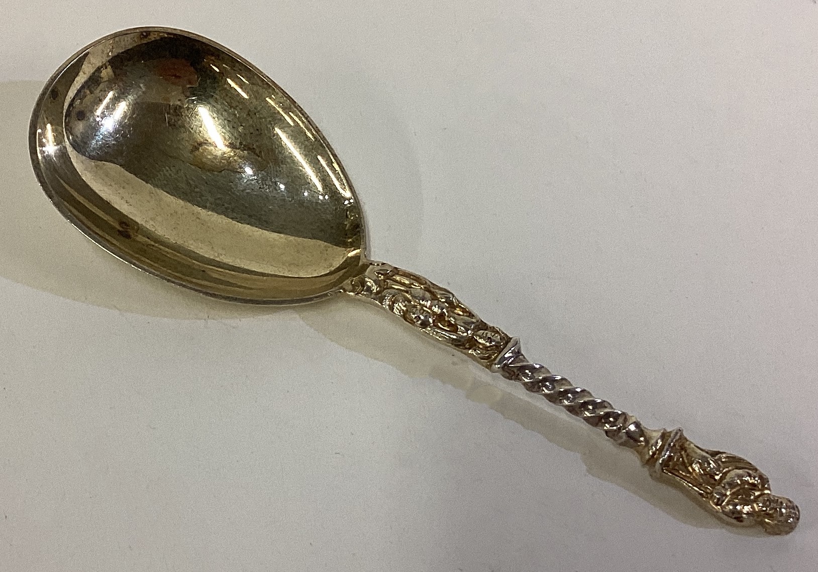A Victorian silver gilt Apostle caddy spoon.