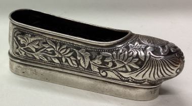 A Chinese silver model of a shoe.