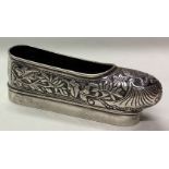 A Chinese silver model of a shoe.