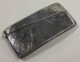 A good oval silver card case with scroll decoration.