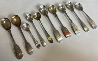 A large collection of silver fiddle pattern and other mustard spoons.
